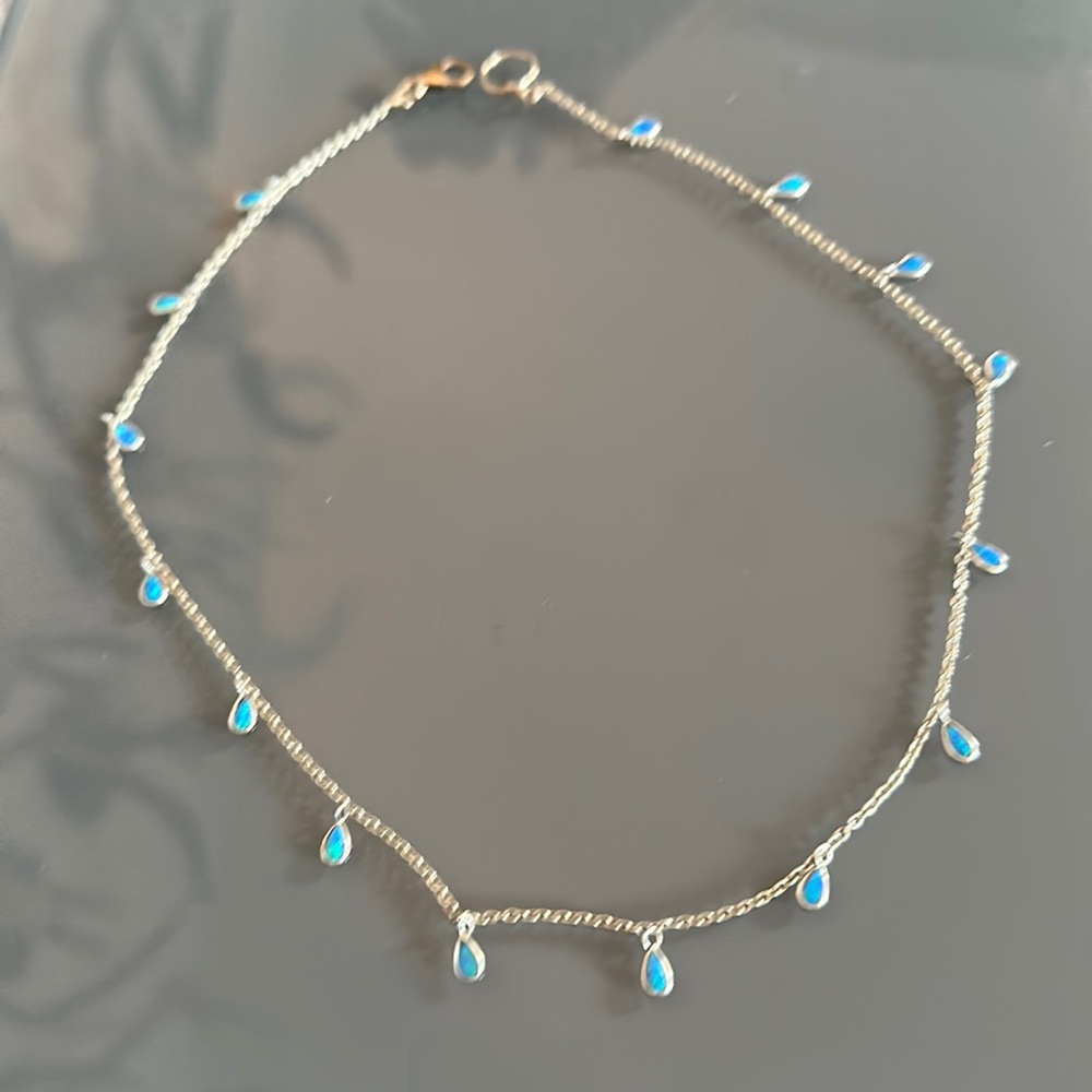 Turquoise stones with silver covering.